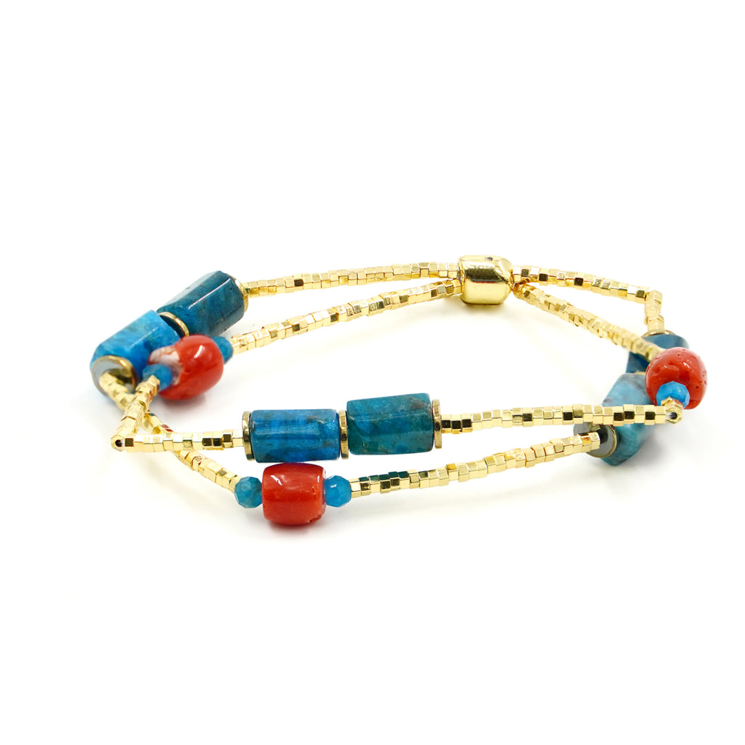 Multi-strand bracelet in coral and apatite mounted on hematite