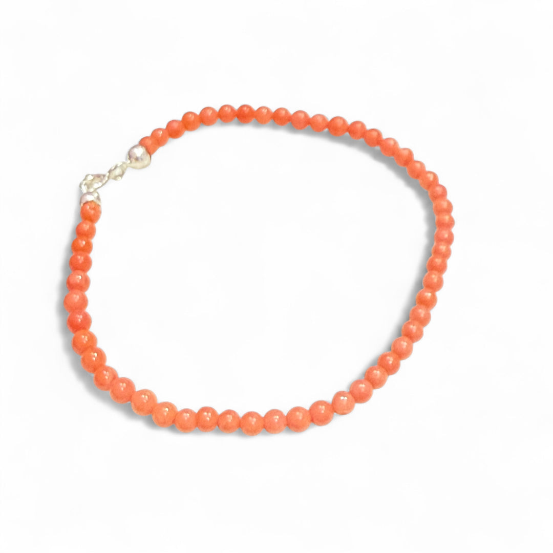 Bracciale perle di corallo rosso montato in argento