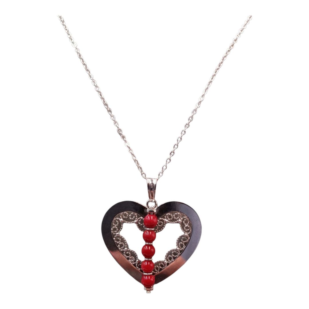 Coral heart pendant mounted on silver