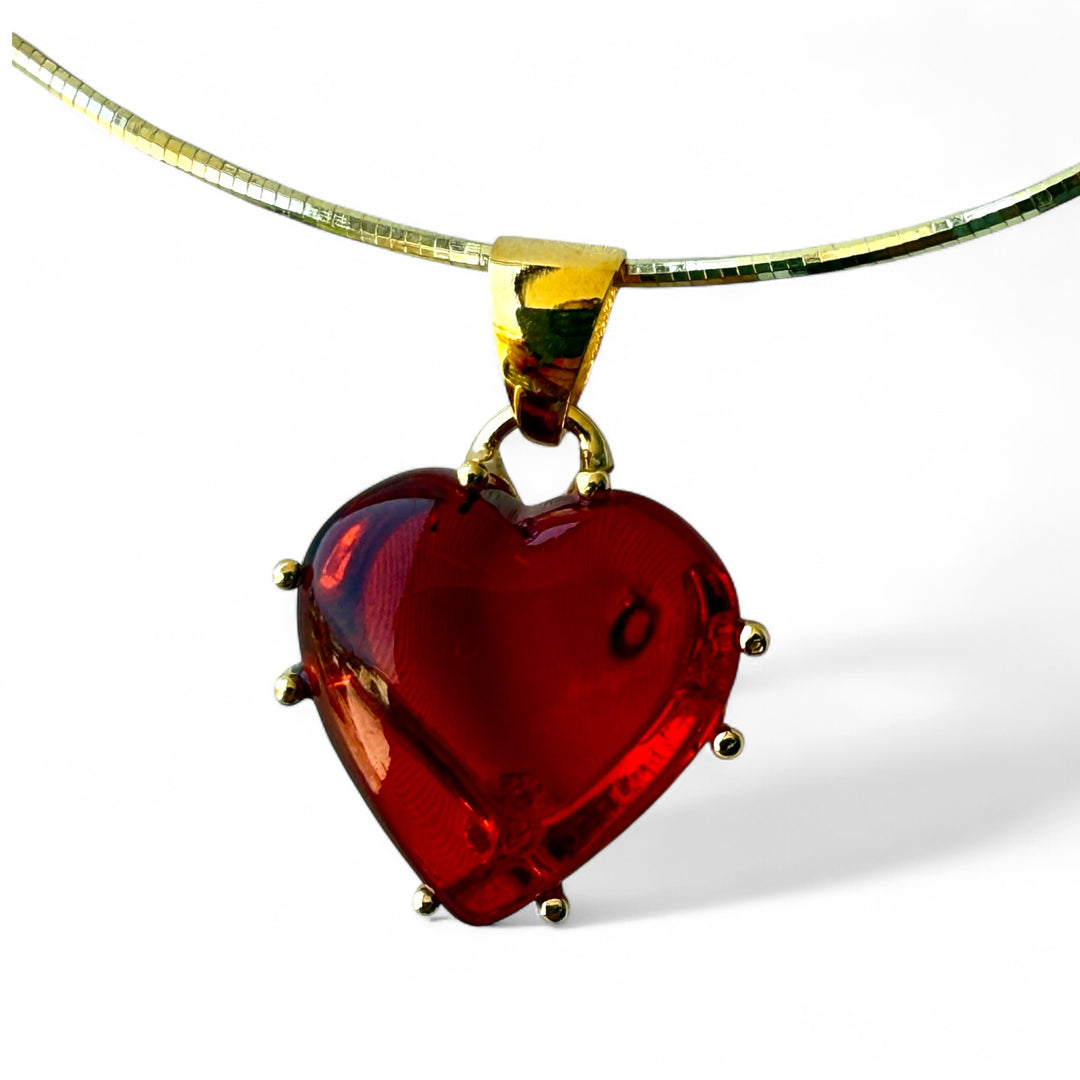 Red amber heart pendant necklace mounted in gold-plated silver