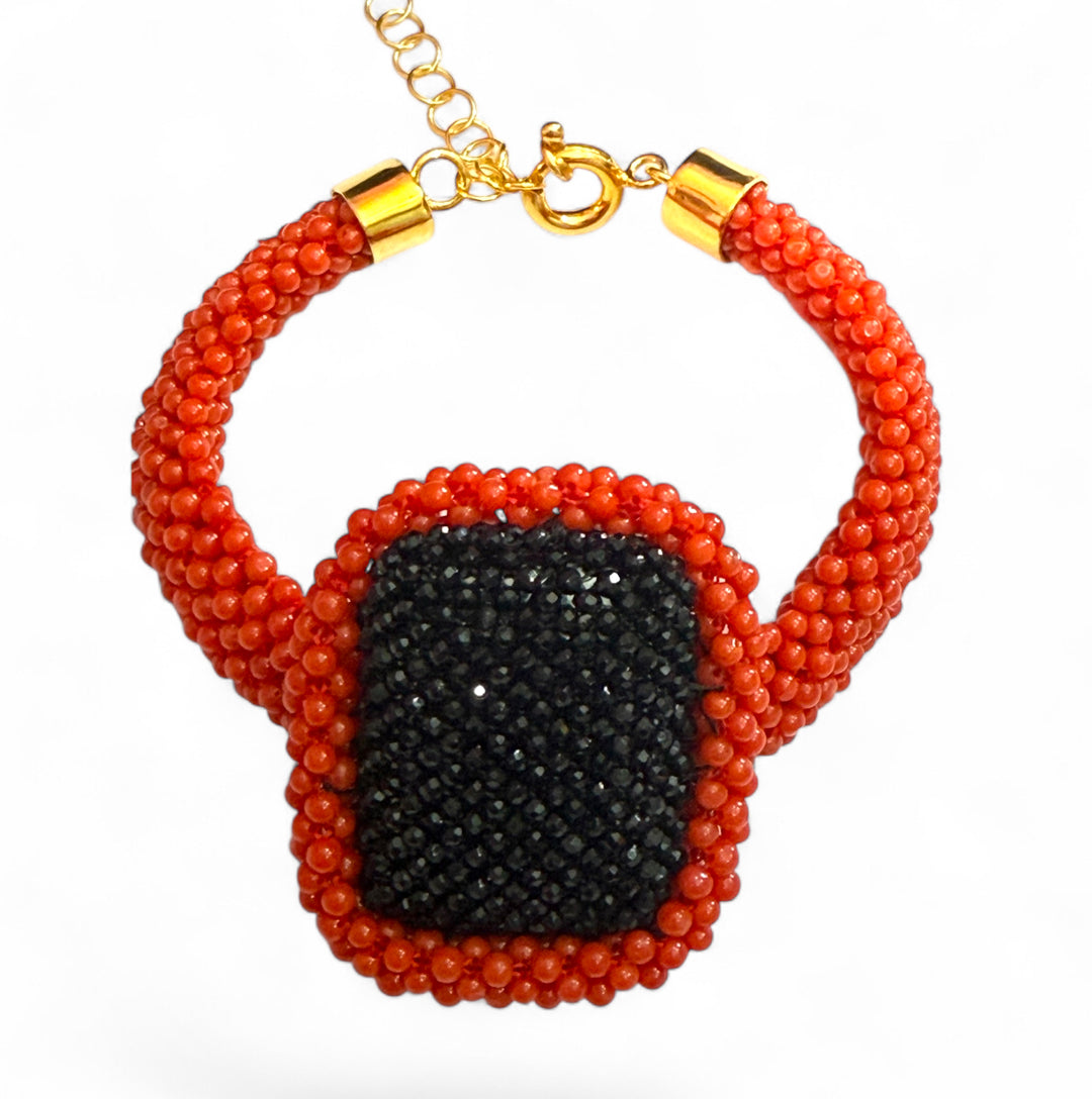 Bracelet made of real red coral and woven black agate mounted on silver