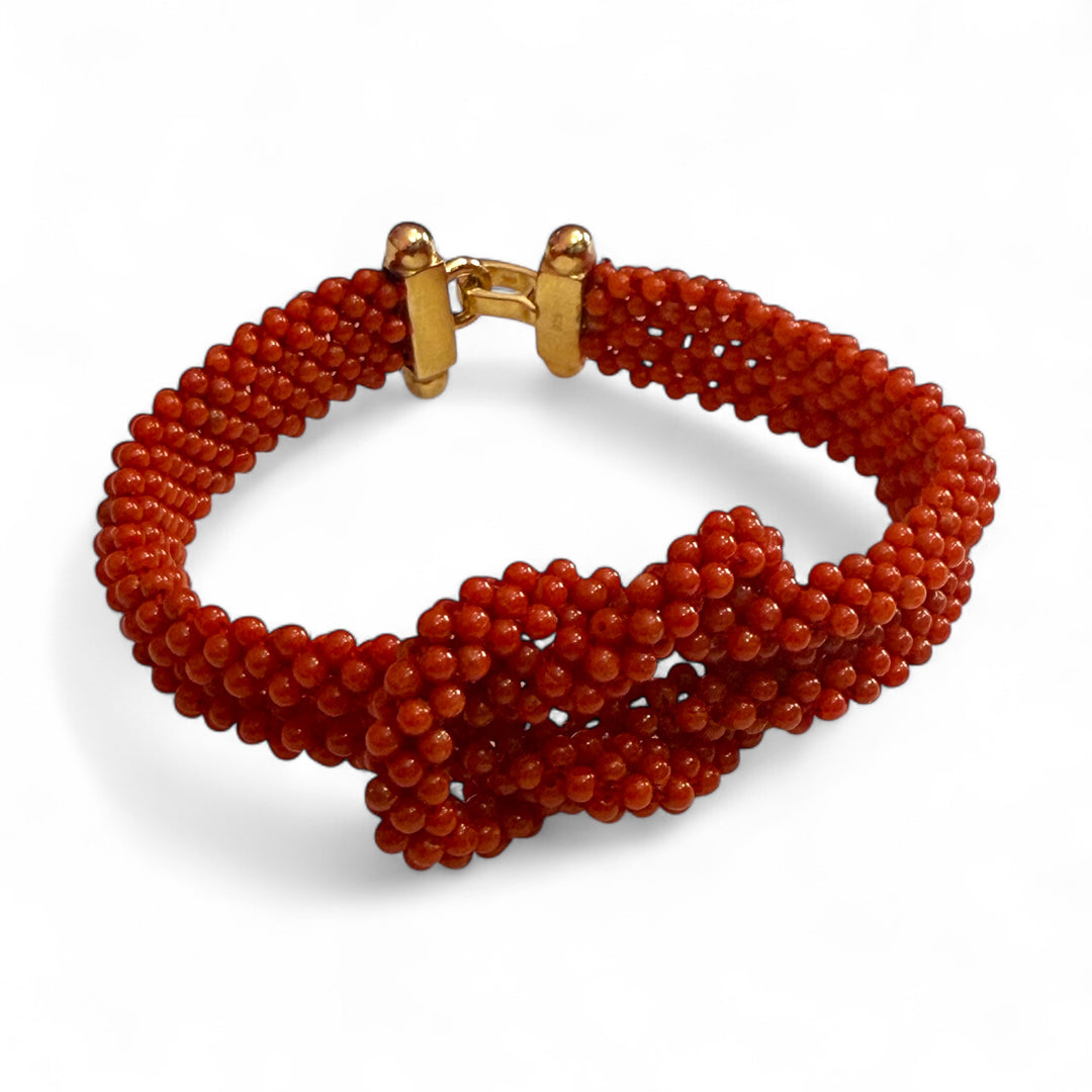 Double knot coral bracelet mounted on silver