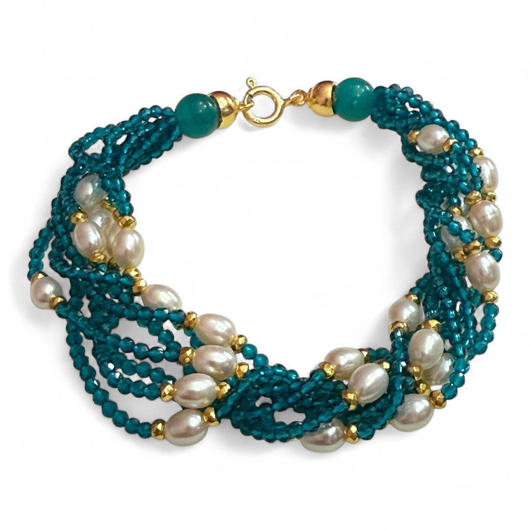 Multi-strand bracelet of river pearls and zircons mounted on silver