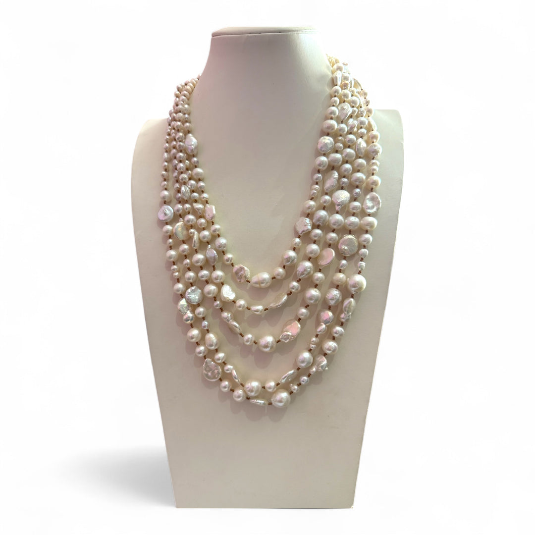 Multi-strand necklace of river pearls and baroque pearls