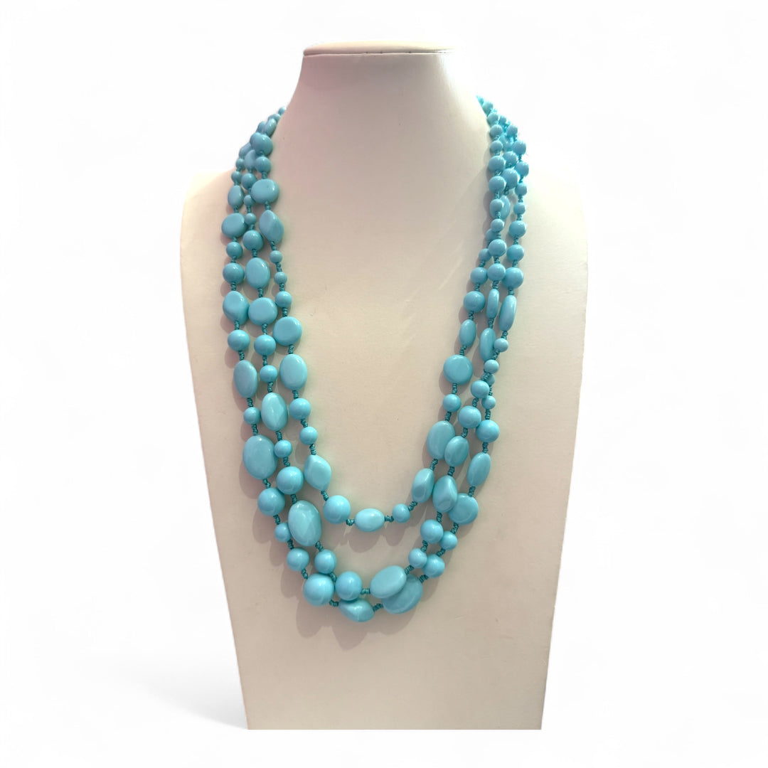 Multi-strand turquoise paste necklace, four flowers.