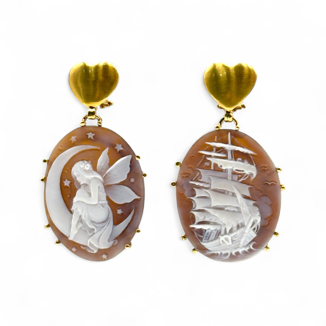 “Moon Wings and Dream Sails” earrings in sardonic cameo mounted in silver