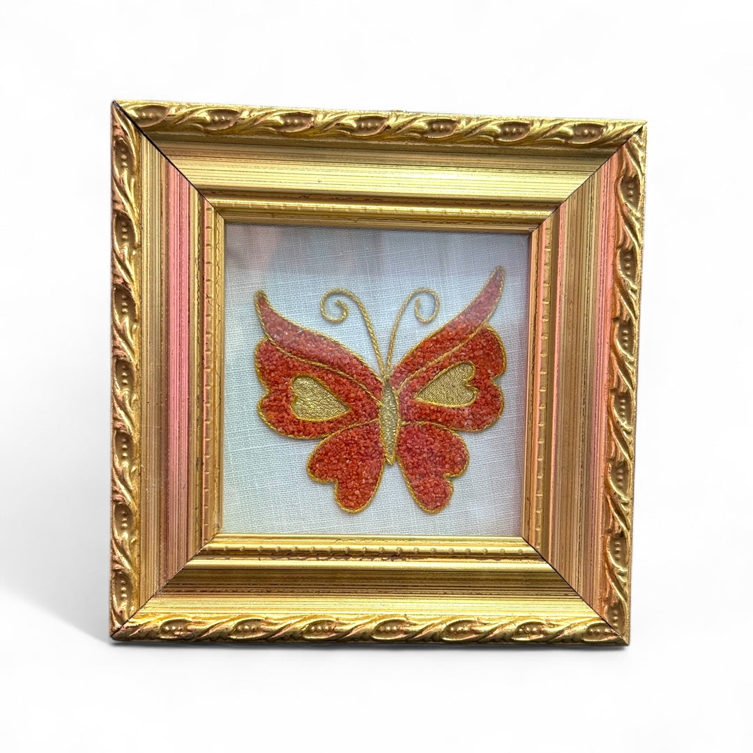 Coral and canvas butterfly painting mounted on wood