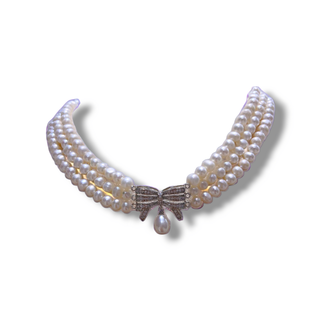 Collana tre fili di perle con fiocco acciaio