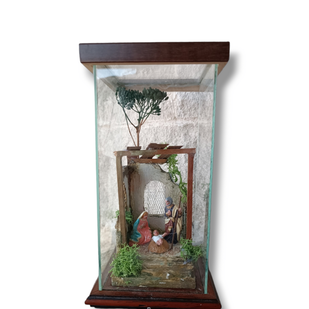 Nativity scene display case on wood