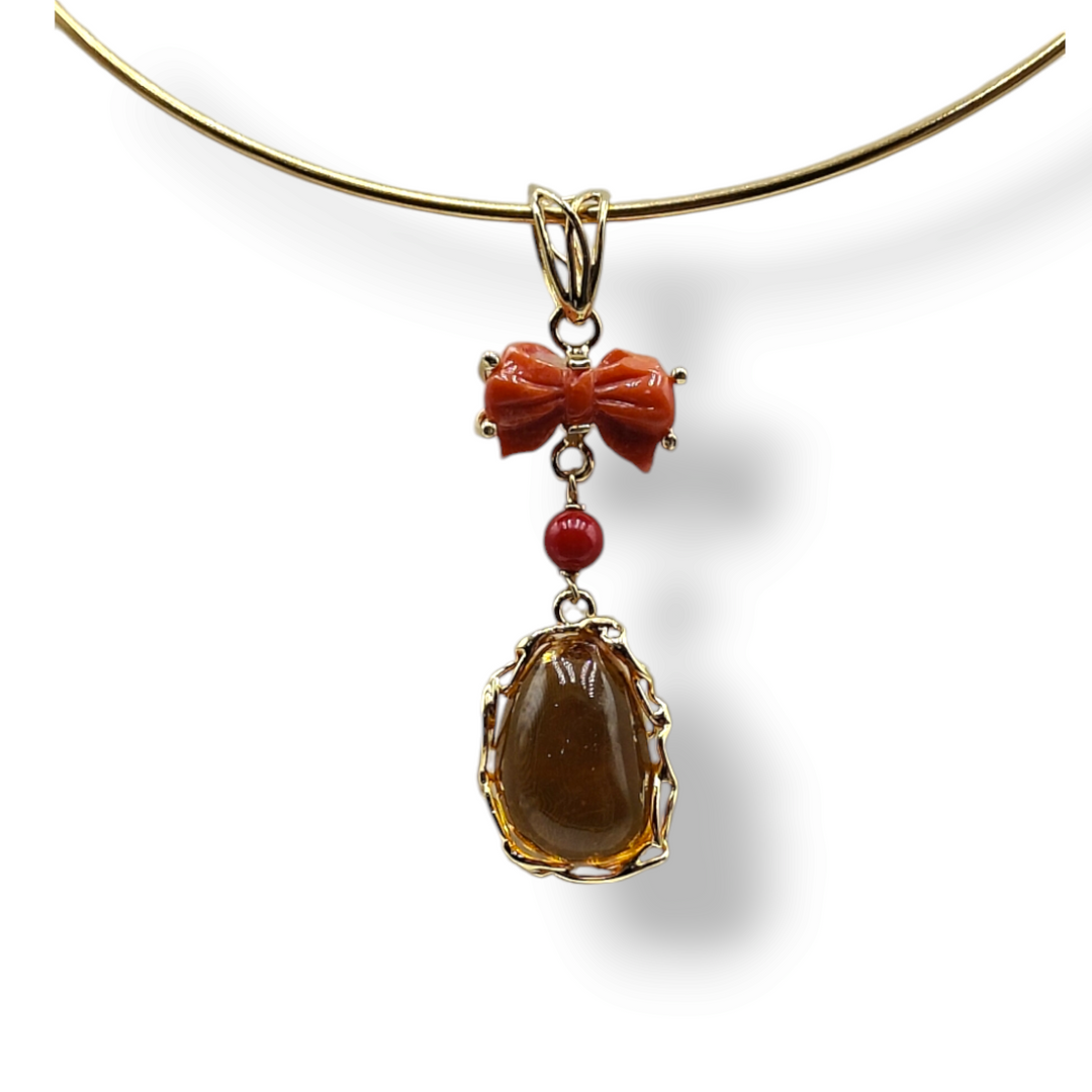 Collana ciondolo "fiocco ambra e corallo" montato su argento