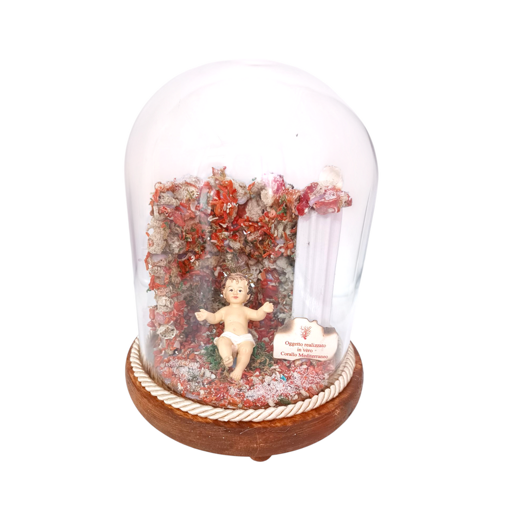 Bell nativity scene with baby Jesus, with a base of red Mediterranean coral