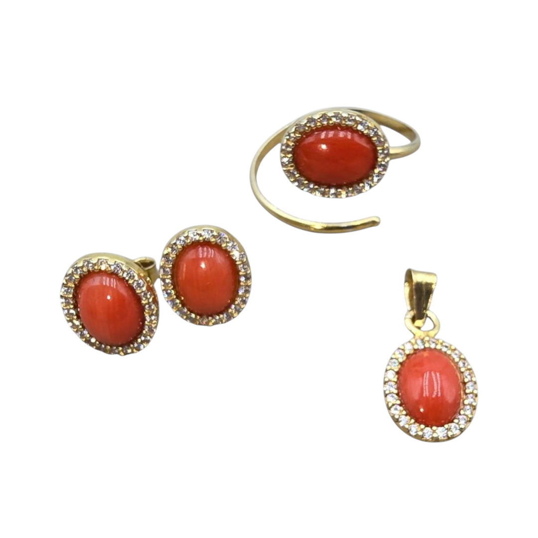 Trio of coral hearts mounted in gilded silver