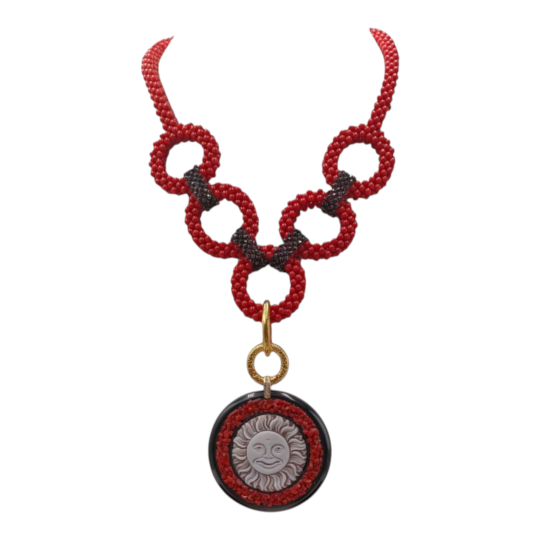 Cameo and coral sun necklace mounted on silver