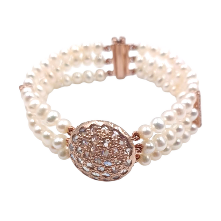 Multi-strand pearl bracelet with Swarovski patch mounted on copper silver