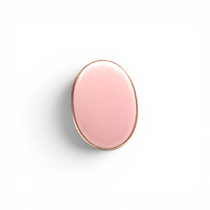 Anello Ovale di Pasta di Corallo rosa montato in Argento Dorato