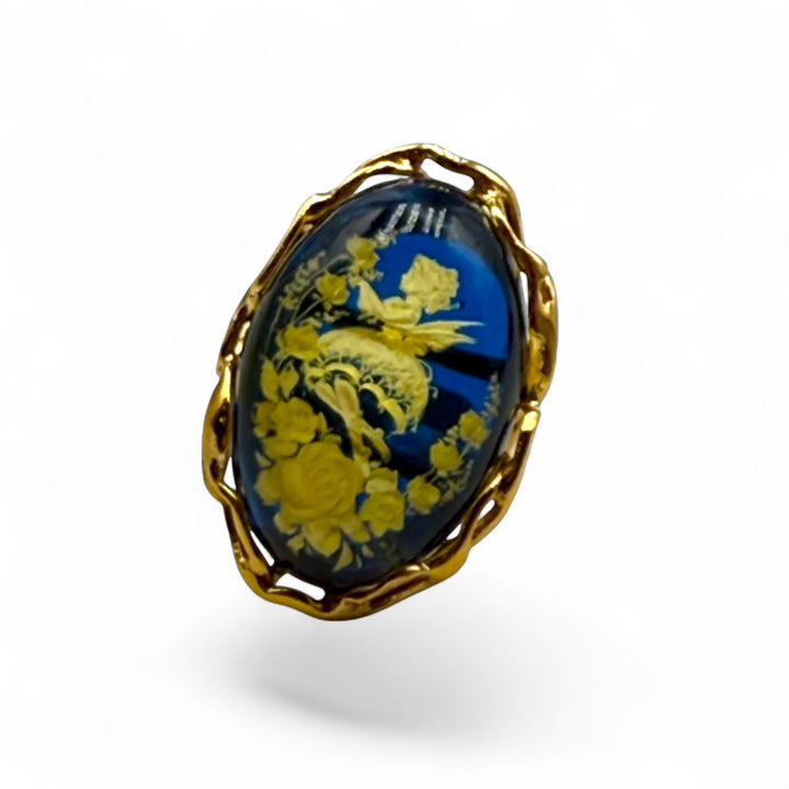 Retro engraved "fairy" ring in blue amber mounted on gold plated silver