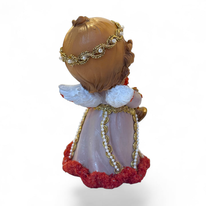 Cherub angel with trumpet with coral