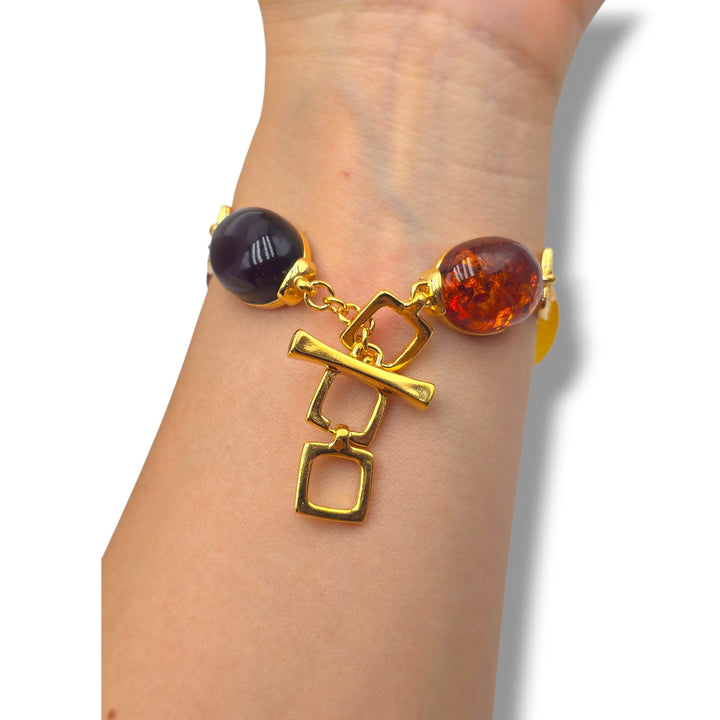Bracciale quadrato di ambra multicolore montato in argento dorato