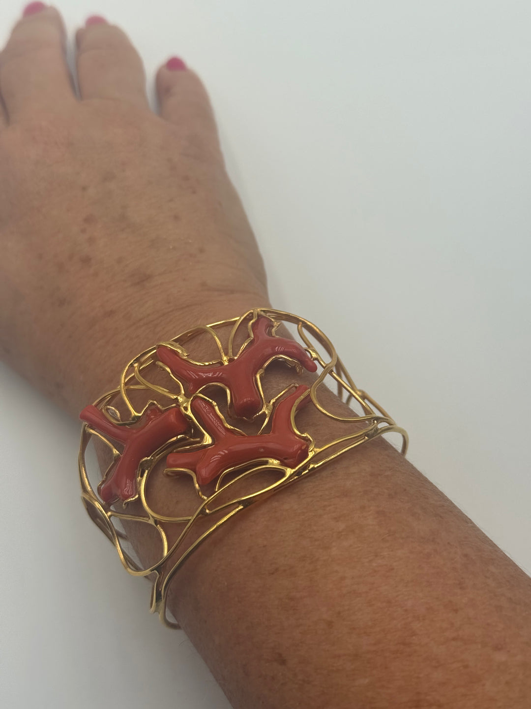Bracciale rami di corallo montato in argento dorato