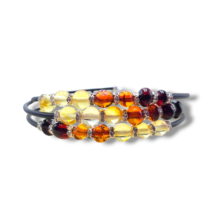 Bracciale “tre in uno” di ambra multicolor montato in caucciù e acciaio