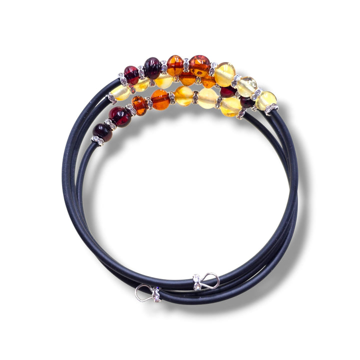 Bracciale “tre in uno” di ambra multicolor montato in caucciù e acciaio