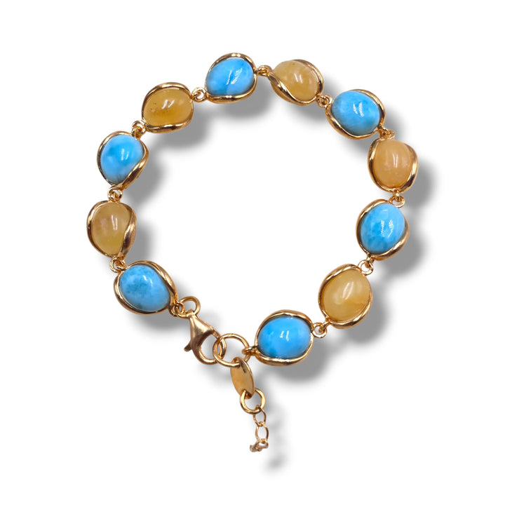 Bracciali multicolore di ambra del baltico e Larimar, montati in argento.
