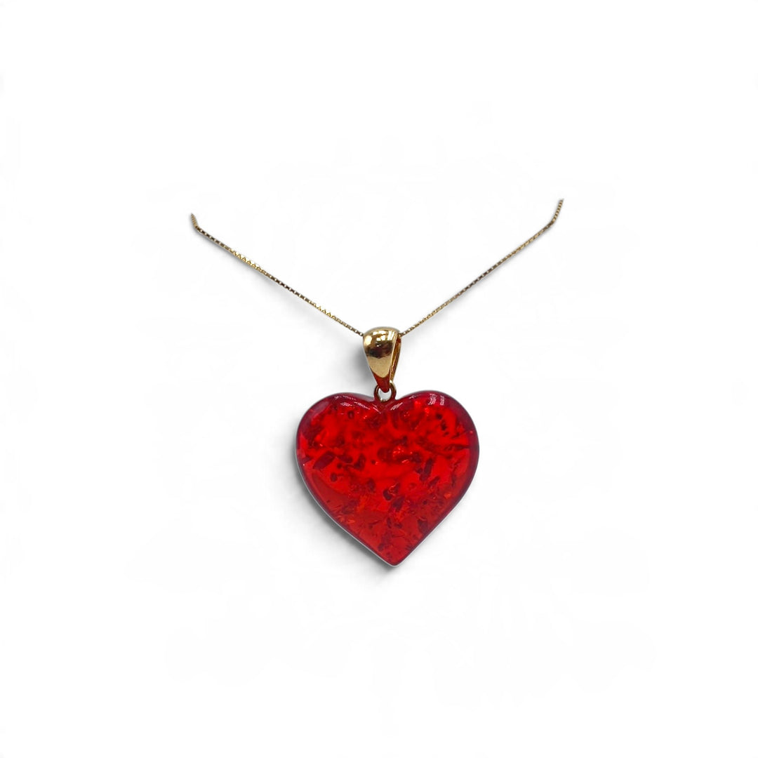 Ciondolo Cuore di Ambra rossa montato in Argento Dorato