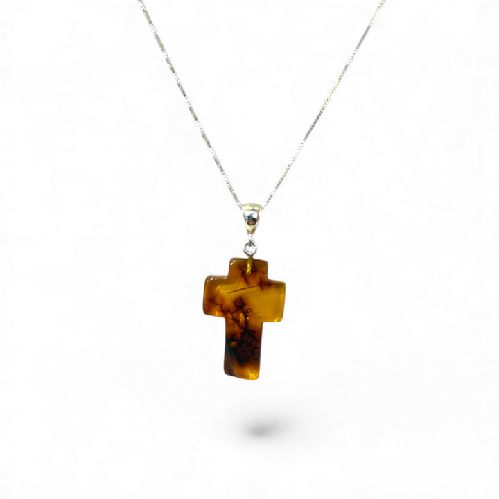 Amber cross pendant mounted in silver