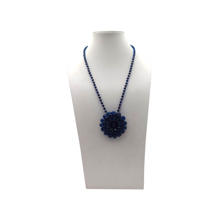 Collana con Fiore e Perle di Ambra blu montata in Ematite Dorata