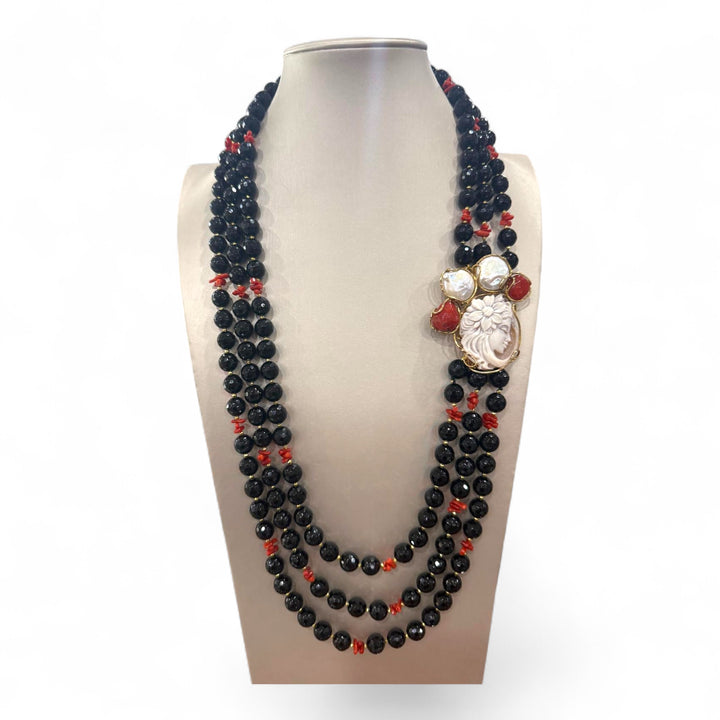 Multi-strand necklace of black agate, coral with cameo mounted in silver