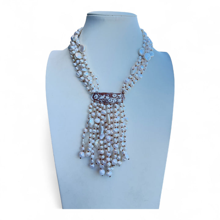 Multi-strand necklace of river and baroque pearls with sardonic cameo and mother-of-pearl