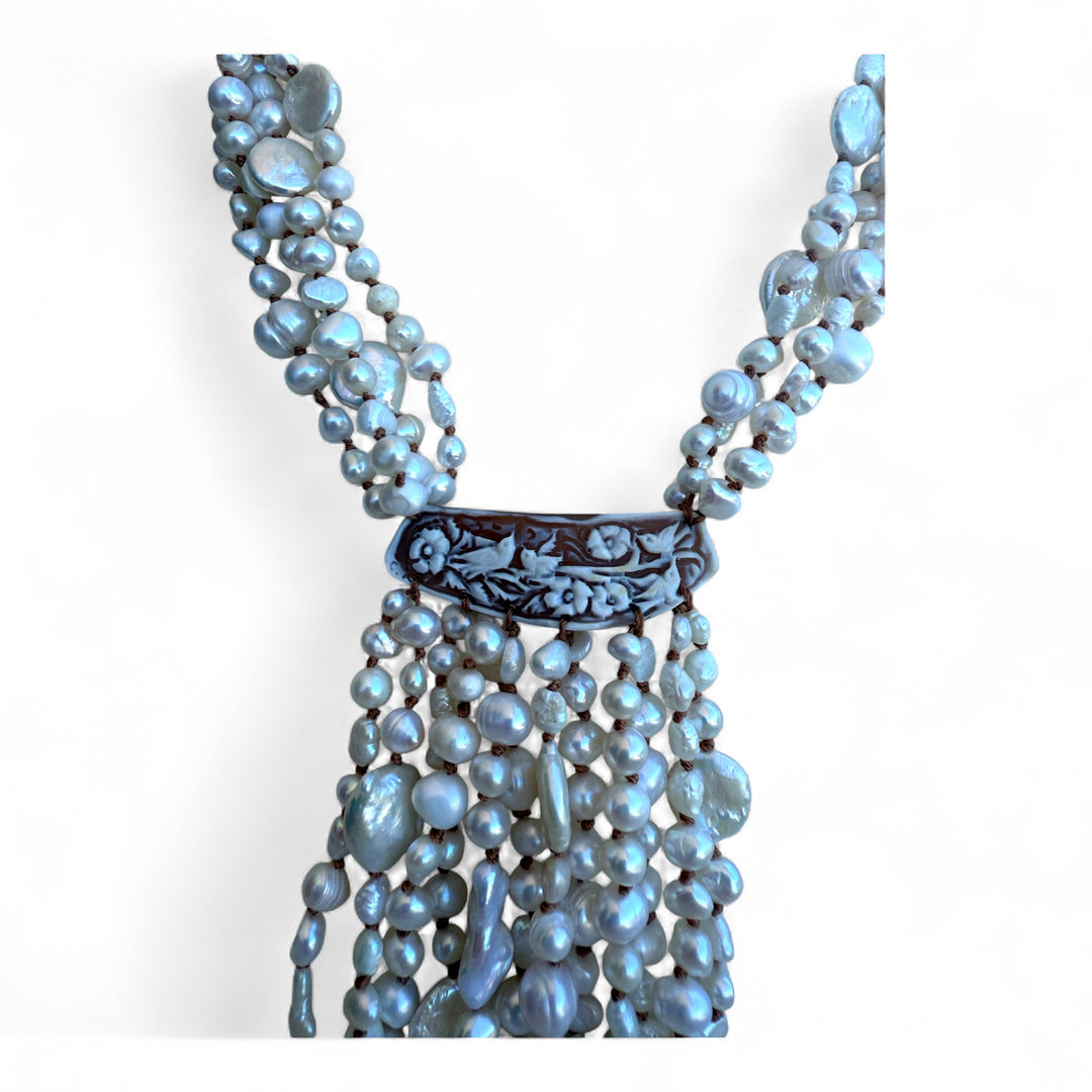 Multi-strand necklace of river and baroque pearls with sardonic cameo and mother-of-pearl