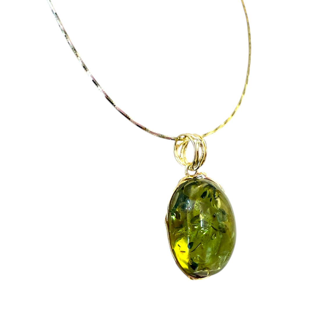Necklace with Oval Green Amber Pendant set in Gold-Plated Silver