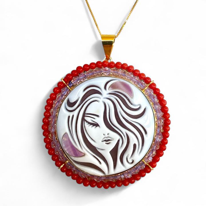 “Nereide” pendant necklace made of sardonic cameo and real mother-of-pearl, set in silver, real coral, and original zirconia.