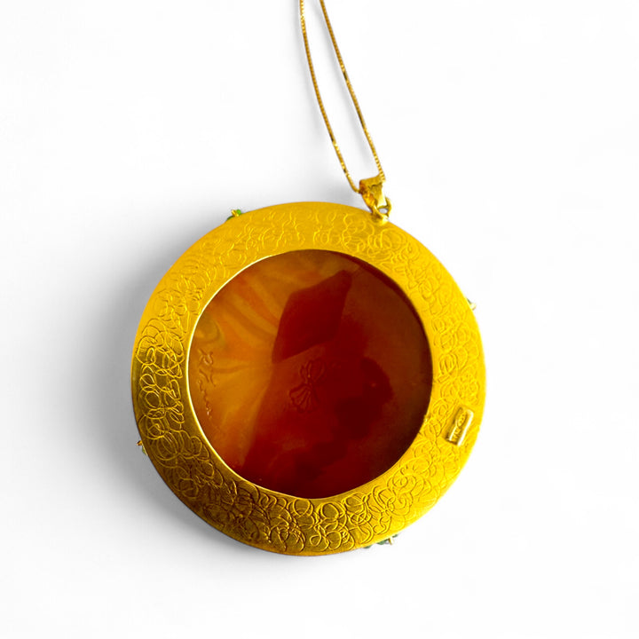 “Nereide” pendant necklace made of sardonic cameo and real mother-of-pearl, set in silver, real coral, and original zirconia.