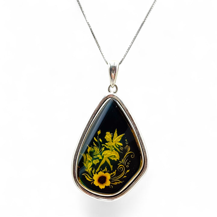 Collana ciondolo “fata” di ambra blu montato in argento