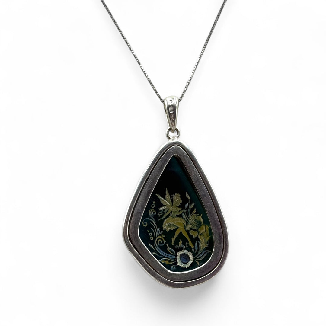 Collana ciondolo “fata” di ambra blu montato in argento