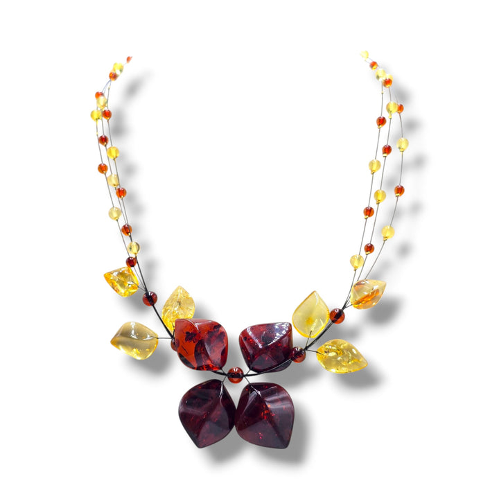 Collana ciondolo floreale di ambra rossa e gialla montata in argento