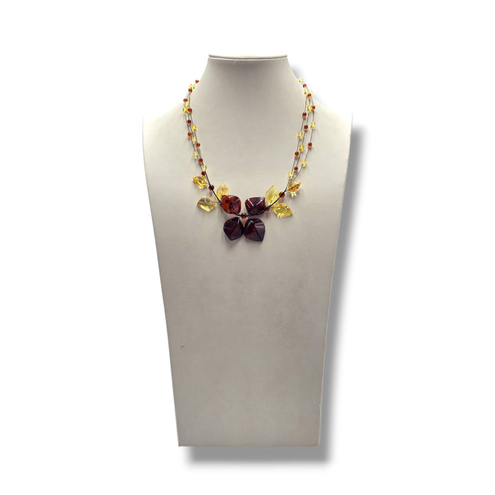Collana ciondolo floreale di ambra rossa e gialla montata in argento