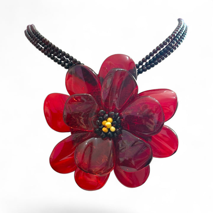 Collana ciondolo “ orchidea in ambra del baltico montata in argento