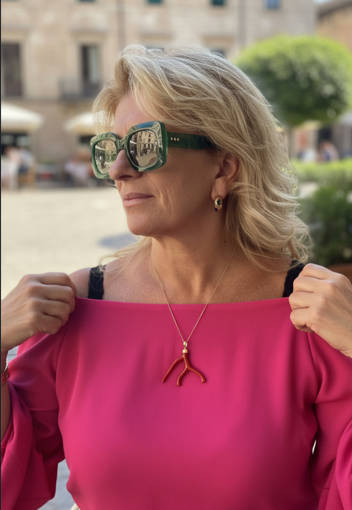 Coral branch pendant necklace mounted on silver