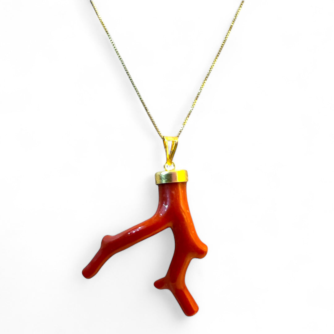 Coral branch pendant necklace mounted on silver