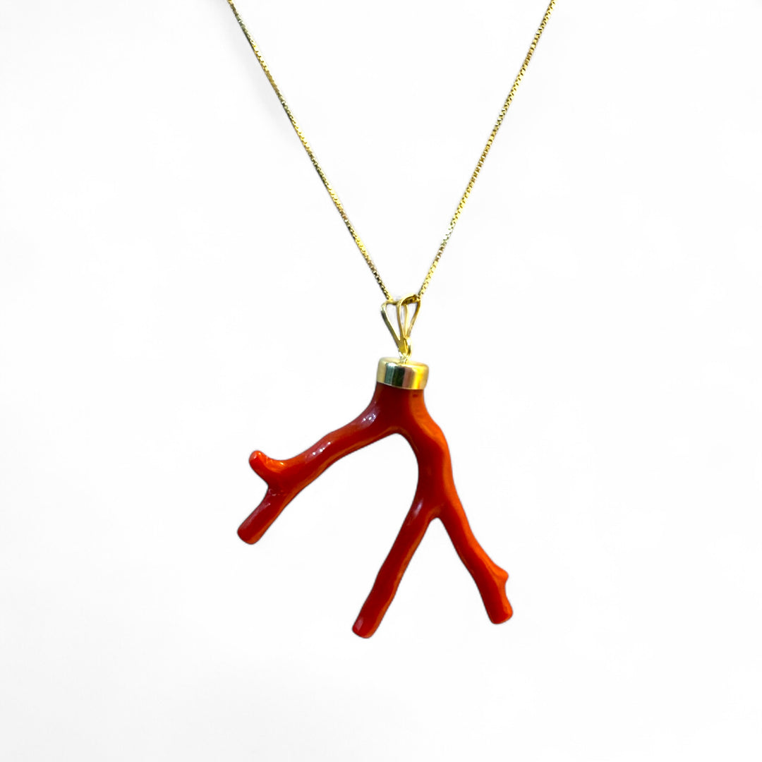 Coral branch pendant necklace mounted on silver