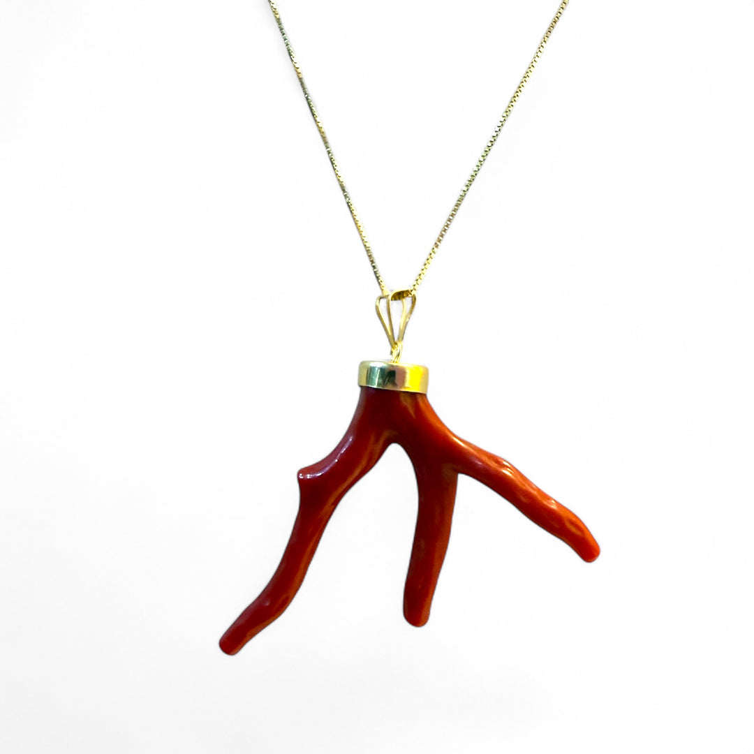 Coral branch pendant necklace mounted on silver
