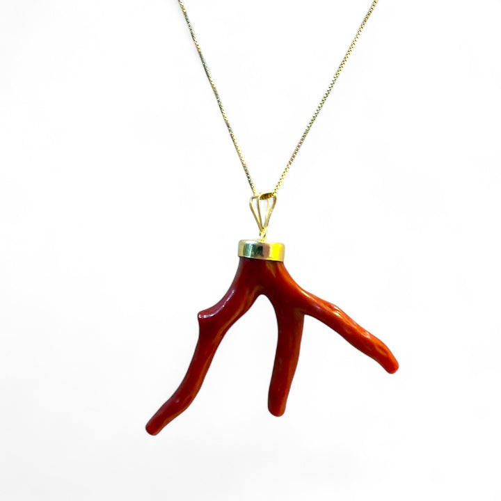 Coral branch pendant necklace mounted on silver