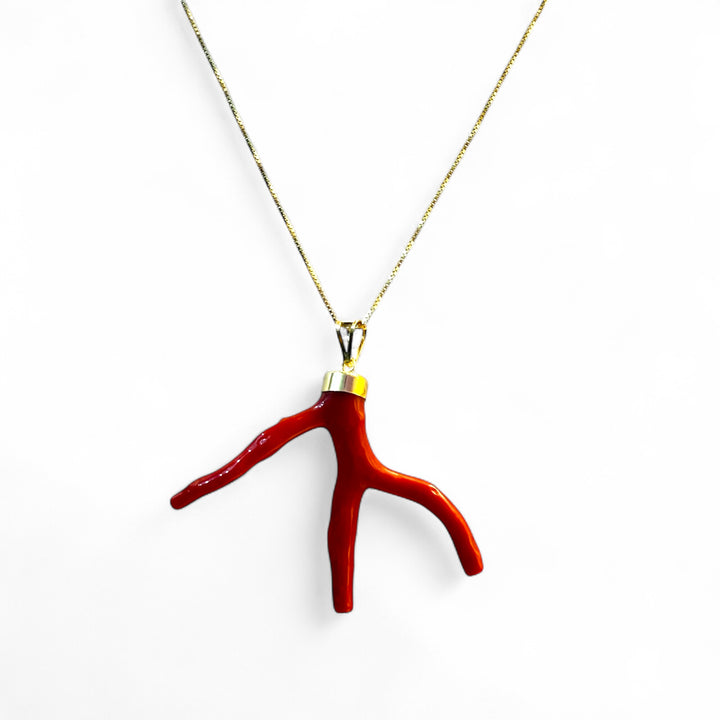 Coral branch pendant necklace mounted on silver