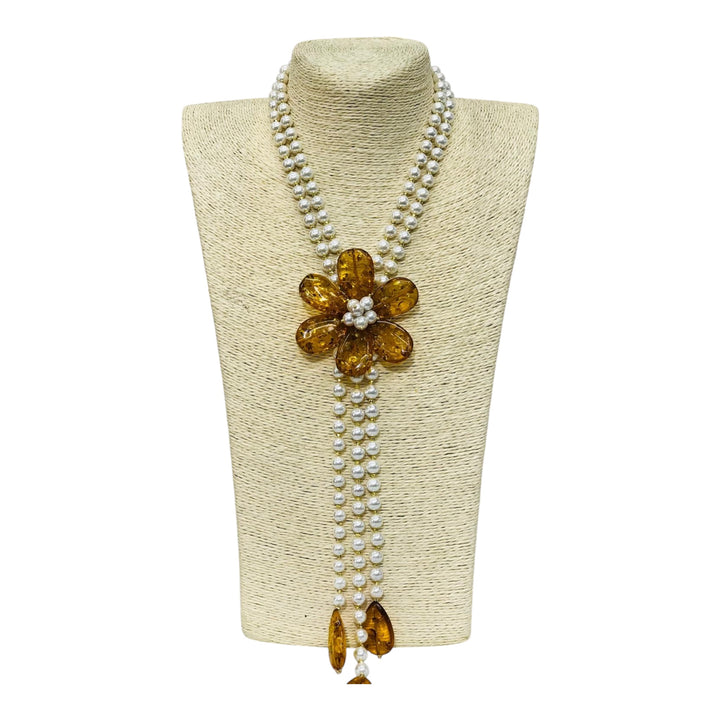 Collana fiore di ambra montata in agata ed in perle di maiorca