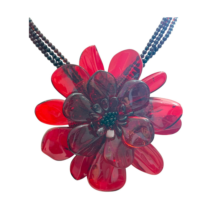 Collana fiore “orchidea” in ambra rossa montato in argento
