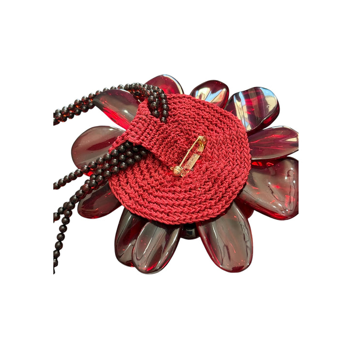 Collana fiore “orchidea” in ambra rossa montato in argento