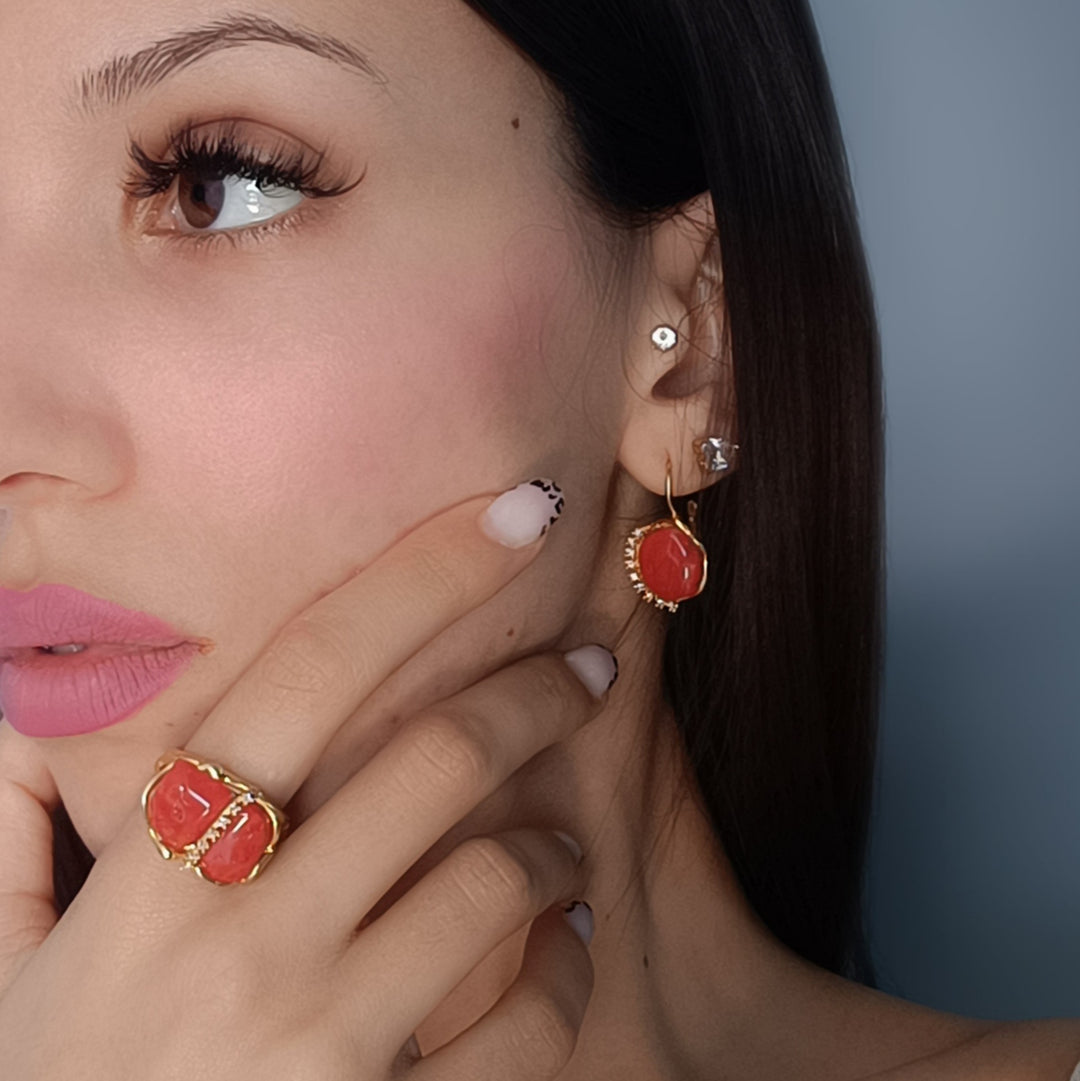 Coral stone and zirconia ring mounted on silver